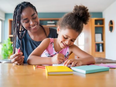 teacher-with-kid-doing-homework (1)